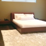 Bedroom,Exquisite Floating Bed Design Ideas With Cool Awesome Brown Bed Frame On Combined White Mattress And Wonderful Two Wood Bedside Table Also Cozy White Fur Rug,Pleasured Floating Bed Ideas