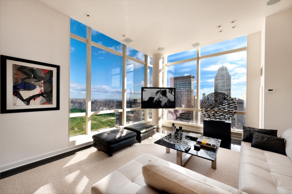 Apartments,Gorgeous White Manhattan Penthouse Apartement Design Ideas With Luxurious White Leather Lounge Sofa On Combined Black Pillow And Cool Black Coffe Table Plus Soft Black Ottoman Also Nice Tv Wall Units For Modern Concept,Manhattan Penthouse Apartments