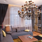 Apartments,Amazing White Wall Paint Studio Apartment Interior Design Inspiration With Charming Grey Sectional Sofa Plus Cool Brown Wood Coffe Table And Beautiful Great Glass Windows On Combined Soft White Curtains Also Elegant Chandelier ,Extraordinary Studio Apartment Interior Designs