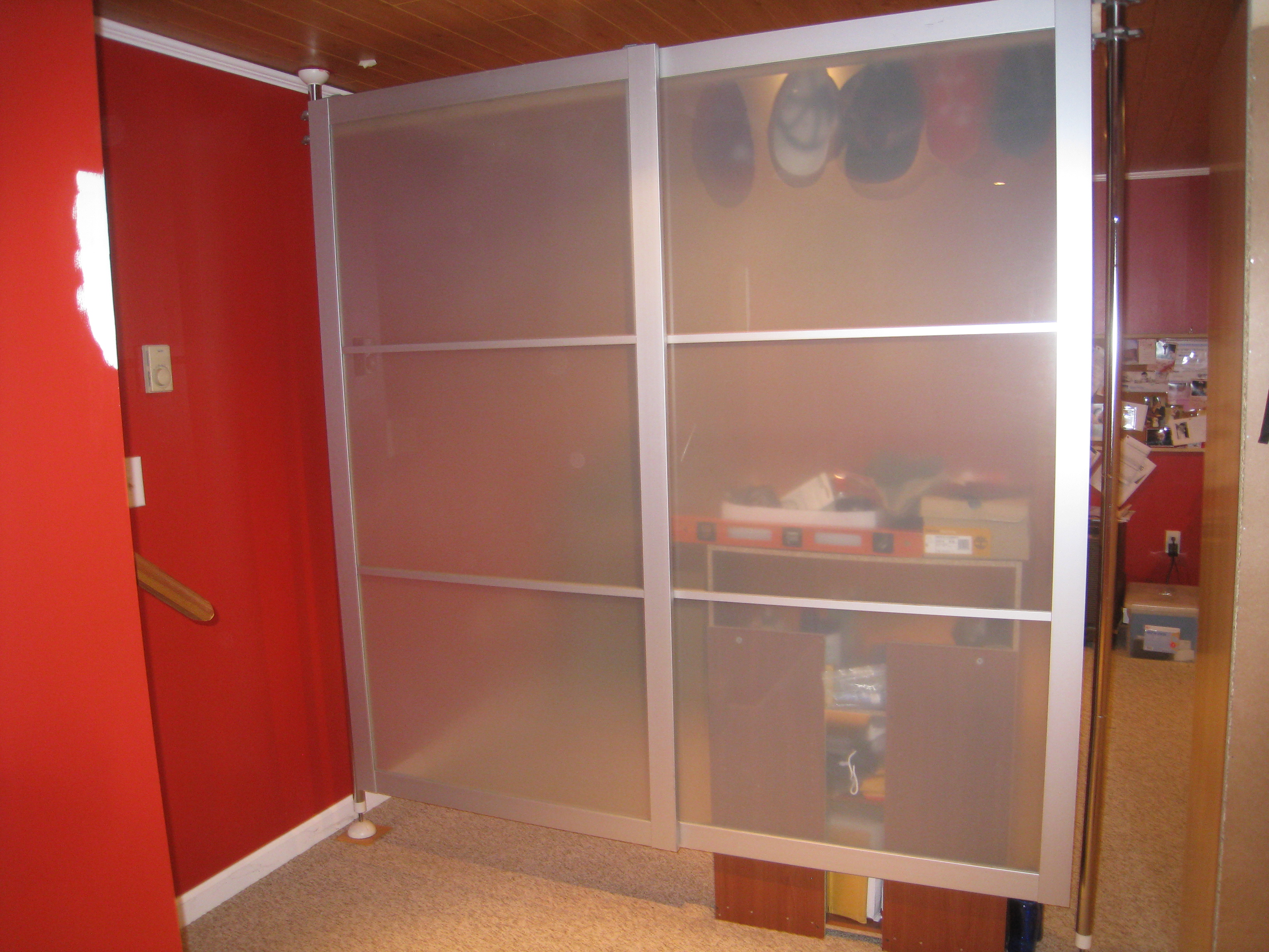 Bedroom,Fabulous Red Wall Paint Ikea Bedroom Closet Design Inspiration With Awesome Frosted Glass Stainless Steel Frame And Nice Brown Wood Linen Ceiling Also Cool Cream Rug,Trendy Furniture Ikea Bedroom Closets