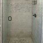 Furniture,Admirable Gray Brick Stone Wall Panel Shower Design Small Bathroom With Charming Glass Door Shower And Nice Black Door Handle Also Beautiful Oil Rubbed Bronze Rain Shower Head,Modern Shower Designs Small Bathrooms