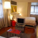 Apartments,Enthralling Small Space Furniture For Apartment Design Ideas With Comfortable White Bed Cover Combined Soft White Fabric Pillows And Gorgeous Cream Drum Tripod Floor Lamp Also Beautiful Large White Transparent Curtains For Bedroom,Cheap Furniture For Apartments Decoration Modern