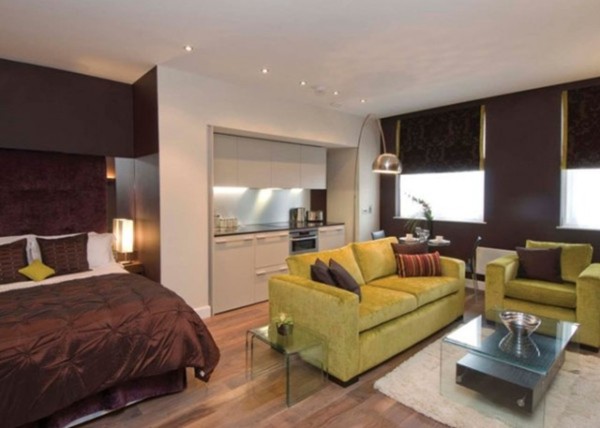 Apartments,Fascinating Small Space Furniture For Apartment Design With Comfortable Brown Bed Cover And Stylish Lime Green Fabric Sofas Combined Trendy Bright Brown Wood Floor Plus Beautiful White Wood Kitchen Cabinet Also Modern Stainless Arc Floor Lamp,Cheap Furniture For Apartments Decoration Modern