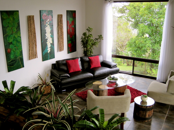 Interior,Awesome Indoor Plant Decoration Ideas With Comfortable Black Leather Two Seater Sofa On Combined Soft Red Cushions And Unique Glass Coffes Table Plus Tree Base Also Wonderful Area Rug In Red Color For Living Room ,Indoor Plant Decoration Ideas