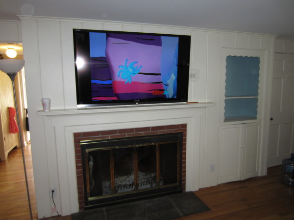 Furniture,Enchanting Tv Wall Panel Design Ideas With Stylish Fireplace Interesting White Wall Polished Mantle Fireplace And Nice Tal Stand Lamp Also Gorgeous Brown Wood Floor ,Modern Tv Wall Panel Designs