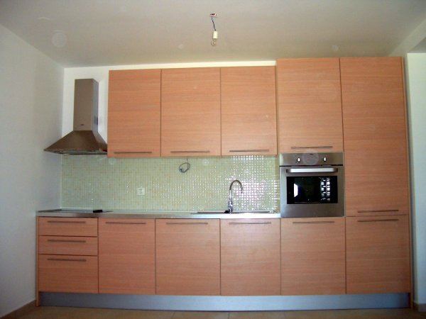 Apartments,Dazzling White Wall Paint Apartment Kitchen Design Ideas With Stylish Natural Large Kitchen Cabinet And Cool Natural Wood Floating Kitchen Cabinet Plus Gorgeous Stainless Countertop Also Modern Corner Cooker Hood,Delightful Apartment Kitchen Designs And Style Modern