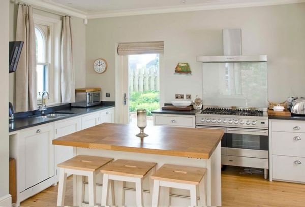 Furniture,Dazzling White Wall Paint Ikea Small Kitchen Design Inspiration With Cool White Wood Kitchen Cabinet On Combined Nice Black Countertop And Rustic White Kitchen Island Plus Comfortable Wood Bar Stools Also Modern Stovetop,Contemporary Ikea Small Kitchen Design Idea