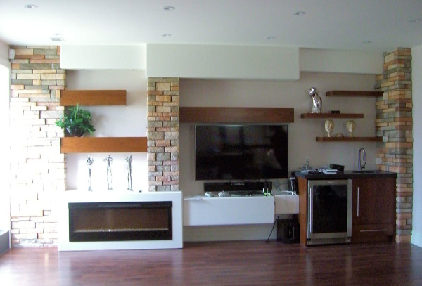Furniture,Extra Large Space Furniture Tv On The Wall Ideas With Fabulous Cherry Wood Shelves And Creative Beams Set Into A Stone Wall Also Beautiful White Fireplace Plus Wonderful Brown Wood Floor,Contemporary Furniture Tv On The Wall Ideas