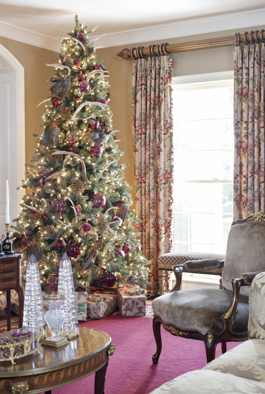 Furniture,Picturesque Beige Wall Paint Best Christmas Decorating Ideas With Stunning Christmas Tree On Combined Beautiful Cream Xmas Tree Lights And Gorgeous Red Glass Ball Ornaments Also Splendid Glass Window Plus Soft Floral Curtains,The Best Christmas Decorating Ideas And Christmas Tree For Your Home