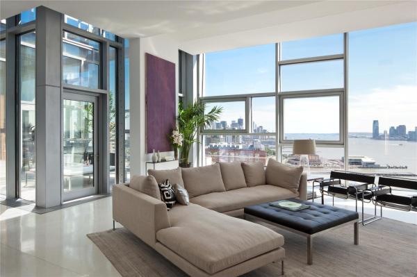 Living Room,Nice Spectacular White Wall Paint Nyc Penthouse Design Ideas With Stunning Beige Fabric Sectional Sofa Plus Cool Black Ottoman On Combined Soft Great Rug In Beige Color And Stylish Black Iron Chairs Also Picturesque Great Glass Windows For Modern Concept,Luxury Nyc Penthouses