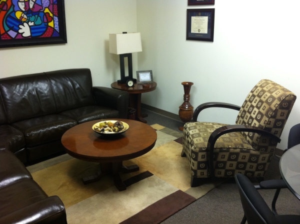 Furniture,Astounding White Wall Paint Pychotherapy Office Decor With Wonderful Black Leather Sofa And Cool Brown Wood Round Table Plus Nice Brown Wood Round Table On Combined Beautiful Table Lamp Also Comfortable Single Seater Sofa,Cool Psychotherapy Office Decor In Home 