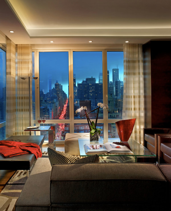 Living Room,Exceptional Small Space Nyc Penthouse Design Ideas With Elegant Gray Sofa And Gorgeous Glass Table Plus Comfortable Black Leather Ottoman Also Beautiful Great Glass Windows On Combined Soft White Curtains,Luxury Nyc Penthouses