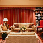 Interior,Splendid Interior Designer Living Room Decoration With Amazing Cream Sofas And Soft Large Red Curtains Between Wall Storage Also Wonderful Cream Fireplace,The Best High Quality And Cheap Interior Designer Living Rooms