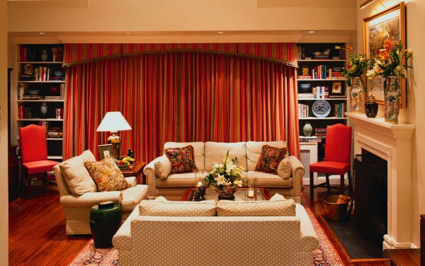 Interior,Splendid Interior Designer Living Room Decoration With Amazing Cream Sofas And Soft Large Red Curtains Between Wall Storage Also Wonderful Cream Fireplace,The Best High Quality And Cheap Interior Designer Living Rooms