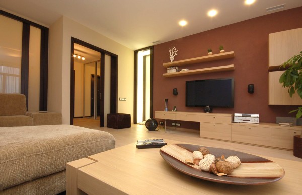 Interior,Enticing Interior Designer Living Room Design Ideas With Cool Bright Brown Wood Entertaiment Center And Beautiful Bright Brown Wood Wall Mount Shelf On The Brown Wall Also Nice Bright Brown Wood Coffe Table,The Best High Quality And Cheap Interior Designer Living Rooms