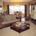 Interior,Dazzling Interior Designer Living Room Design Ideas With Stunning Three Seater Sofa In Beautiful Brown Leather Sofa Frame And Cool Square Glass Table Also Comfortable Breakfast Nook Plus Splendid White Wood Freestanding Cabinet,The Best High Quality And Cheap Interior Designer Living Rooms