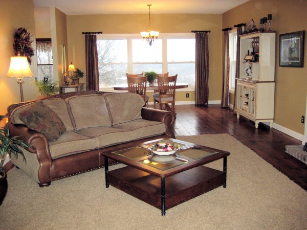 Interior,Dazzling Interior Designer Living Room Design Ideas With Stunning Three Seater Sofa In Beautiful Brown Leather Sofa Frame And Cool Square Glass Table Also Comfortable Breakfast Nook Plus Splendid White Wood Freestanding Cabinet,The Best High Quality And Cheap Interior Designer Living Rooms