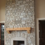 Interior,Enticing Light Brown Wall Paint Stone Fire Places Design Ideas With Wonderful Wall Tiles Cast Stone Fireplace And Cool Bright Brown Wood Wall Mount Shelf Also Trendy Dark Brown Wood Linen Floor,The Beauty Of Stone Fire Places Your Home Inspiration