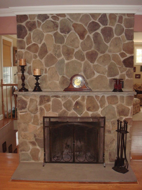 Interior,Affordable Gray Stone Fire Places Design With Beautiful Black Wood Fireplace Candle Stands And Trendy Brown Wood Floor,The Beauty Of Stone Fire Places Your Home Inspiration