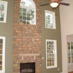 Interior,Breathtaking White Ceiling Indoor Stone Fireplace Design Inspiration With Cool Bright Brown Brick Stone And Beautiful Brown Over Fan Ceiling Also Gorgeous White Wood Windows Frame,Amazing Indoor Stone Fireplace Designs To A Living Room
