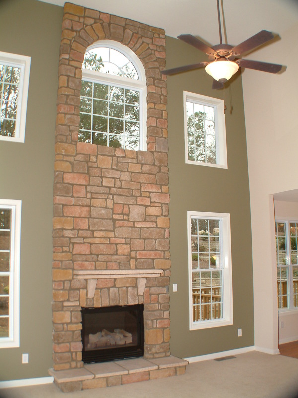 Interior,Breathtaking White Ceiling Indoor Stone Fireplace Design Inspiration With Cool Bright Brown Brick Stone And Beautiful Brown Over Fan Ceiling Also Gorgeous White Wood Windows Frame,Amazing Indoor Stone Fireplace Designs To A Living Room
