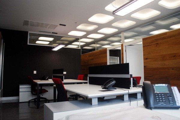 Furniture,Admirable Large Space Top Office Design Ideas With Wonderful White Office Desks And Comfortable Red Wheels Office Chairs Plus Cool Over Ceiling Lamp Also Nice Brown Wood Panels,Pleasant And Comfortable Top Office Designs