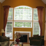 Interior,Unusual Beige Wall Paint Large Window Curtain Ideas With Charming White Wood Window Frame And Stylish Fireplace Also Comfortable Black Single Seater Sofa Plus Cool Glass Table,Good Large Window Curtain Ideas
