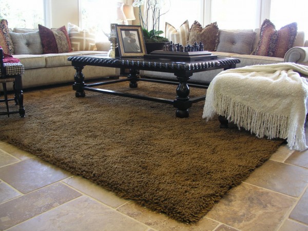 Living Room,Unusual Area Rug Inspiration Design LIving Room With Beautiful Black Table And Laminate Flooring Also Luxury Sofa,Modern Style Area Rugs For LIving Room
