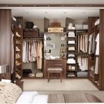 Furniture,Beautiful Beige Wall Paint Walk In Wardrobe Design Inspiration With Wonderful Brown Painted Wood Walk In Wardrobe Plus Nice Bright Brown Wood Hanger And Soft Gray Stool Also Cool Brown Wood Sliding Doors,Cool Amazing Some Walk In Wardrobe Designs
