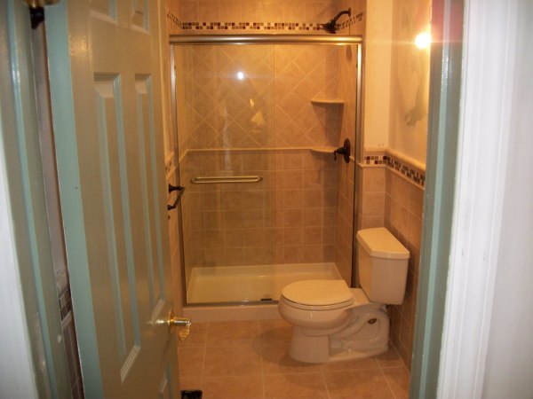 Bathroom,Adorable Cream Tile Wall Design Small Bathroom With Beautiful Glass Sliding Door Shower And Charming Black Faucet Shower Also Comfortable White Ceramic Closet Seat ,Amazing Designing Small Bathrooms