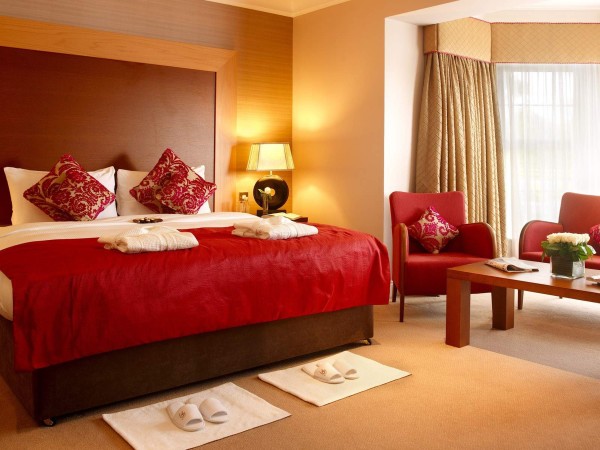 Bedroom,Extraordinary Brown Wood Wall Panel Bedroom Color And Design With Adorable Brown Wood Bed Frame On Combined Soft Red Bed Cover Also Trendy Brown Wood Table Plus Comfortable Red Single Seater Sofas,Affordable Teenage Bedroom Colors And Designs Latest