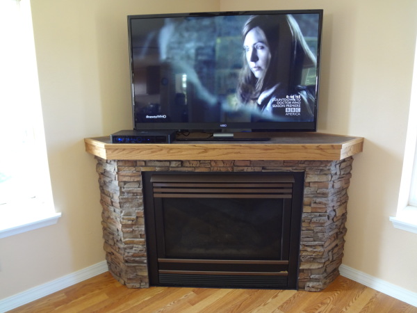 Furniture,Enticing Corner Tv Wall Panel Design Inspiration With Marvelous Stacked Stones Corner Fireplace And Beautiful Bright Wood Floor ,Modern Tv Wall Panel Designs