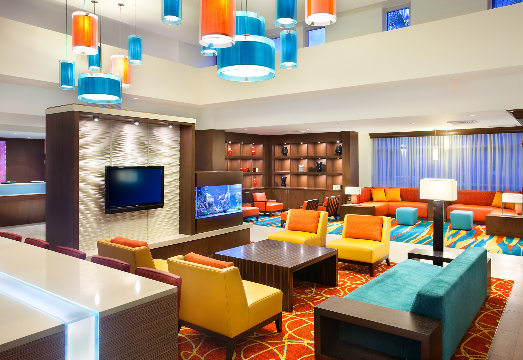 Furniture,Delightful Interior Design Architect With Adorable Colorful Sofas And Beautiful Brown Wood Table Plus Nice Tv Wall Units Also Wonderful Orange Blue Pendant Lamps,Modern Interior Design Architects For Your Homes