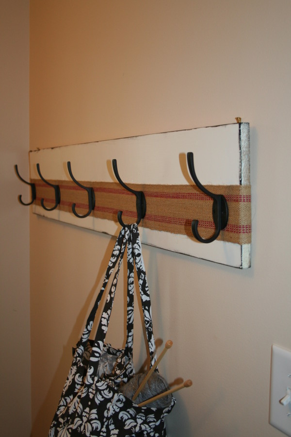 Interior,Adorable Coat Hanger Design Ideas With Wonderful White Wood Wall Mounted Cook Hooks And Stylish Bright Brown Mixed Red Jute Webbing Also Nice Cream Wall Paint,The Best High Quality And Unique Coat Hangers