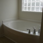Bathroom,Cool Amazing Wall Light Design With Astonishing Glass Block Features White Wall Bath Panels And Charming White Ceramic Garden Bathtub Also Modern Stainles Faucet In Trendy White Porcelain Material,Classic Wall Lights Inside Bathroom