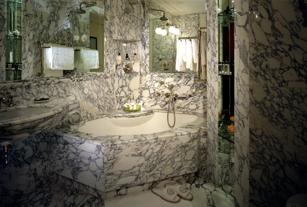 Bathroom,Nice Spectacular Small Space Stone Bathroom Design Ideas With Cool Coner Bathtub On Combined Modern Black White Marble Floor And Nice Chrome Shower Head Also Beautiful Floating Vanity Vessel Sink For Elegant Concept,Natural Stone Bathroom Designs