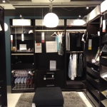 Furniture,Unusual Walk In Wardrobe Design Ideas With Charming Black Walk In Wardrobe And Comfortable Black Cushion Ottoman On Combined Soft Gray Fur Rug Also Beautiful White Oversized Pendant Lamp,Cool Amazing Some Walk In Wardrobe Designs