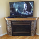 Interior,Inexpensive Tile Stone Fire Places Design With Stylish Corner Brick Stone Tile Fireplace And Modern Corner Tv Also Wonderful Bright Brown Wood Floor,The Beauty Of Stone Fire Places Your Home Inspiration