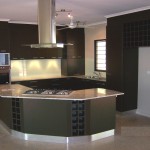Furniture,Admirable Small Space Kitchen Island Design Inspiration With Charming Black Kitchen Cabinet And Modern Stainless Cooker Hood Plus Cool Ceiling Fan Also Unique Curved Kitchen Island Combined Wonderful White Marble Countertop,Modern Kitchen Island Designs