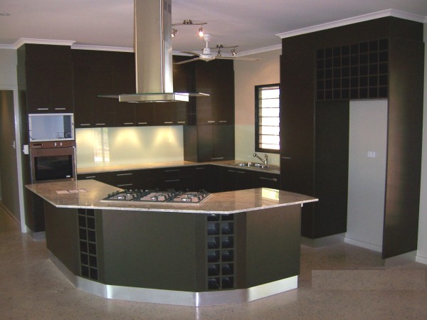Furniture,Admirable Small Space Kitchen Island Design Inspiration With Charming Black Kitchen Cabinet And Modern Stainless Cooker Hood Plus Cool Ceiling Fan Also Unique Curved Kitchen Island Combined Wonderful White Marble Countertop,Modern Kitchen Island Designs