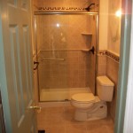 Bathroom,Nice Looking Small Bathroom Design Idea With Beautiful Bathroom Glass Sliding Door Frameless And Comfortable White Ceramic Toilet Also Splendid White Wood Door,The Best Beautiful And Small Bathroom Design Ideas