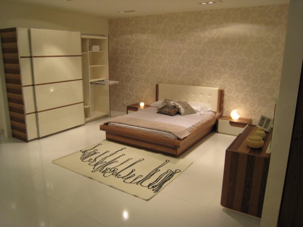 Bedroom,Cool Awesome Floral Wall Sticker Smart Bedroom Design Ideas With Traditional Wood Bed Frame On Combined Soft White Mattress And Nice Two Bedside Table Also Cool White Sliding Door Wood Wardrobe,Modern Smart Bedroom Design To Comfort Sleeping