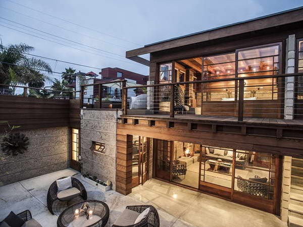 Architecture,Breathtaking Large Modern House Design With Splendid Brown Painted Stainless Steel Balcony Fence And Comfortable Black Rattan Wood Chairs Also Gorgeous Mahogany Wood Doors For Traditional Concept,Flawless Large Modern Houses Inspiration