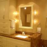Bathroom,Awesome Beige Wall Paint Wall Light Design With Wonderful White Bathroom Vanity Cabinet On Combined Trendy Brown Granite Countertop And Nice Stainless Bathroom Faucet Also Cool White Frames Wall Mirror,Classic Wall Lights Inside Bathroom