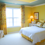 Bedroom,Awesome Yellow Wall Painted Modern Bedroom Color Scheme Design Inspiration With Comfortable Low Profile Bed On Combined White Yellow Color And Cozy Cream Fabric Single Sofa Also Beautiful Large Window Plus Nice Yellow Floral Curtains,Modern Bedroom Color Schemes