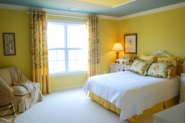 Bedroom,Awesome Yellow Wall Painted Modern Bedroom Color Scheme Design Inspiration With Comfortable Low Profile Bed On Combined White Yellow Color And Cozy Cream Fabric Single Sofa Also Beautiful Large Window Plus Nice Yellow Floral Curtains,Modern Bedroom Color Schemes