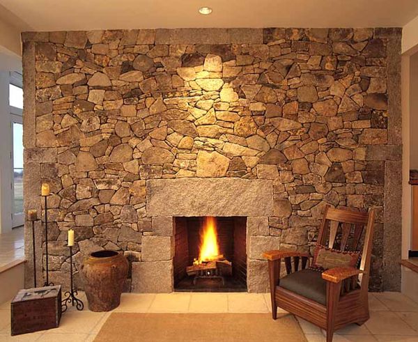 Interior,Stylish Cream Ceiling Indoor Stone Fireplace Design Inspiration With Beautiful Stone Fireplace And Cozy Brown Wood Chairs Also Vintage Three Candle Floor Lamp Plus Soft Cream Rug On Combined Nice White Ceramic Tile Floor,Amazing Indoor Stone Fireplace Designs To A Living Room