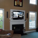 Furniture,Astounding Large Space Flat Screen Tv Wall Design Ideas With Cool White Tv Wall Unit Plus Beautiful Fireplace And Comfortable Brown Single Seater Sofa Also Wonderful White Wood Window Frames,Stunningly Beautiful And Modern Flat Screen Tv Wall Designs