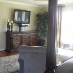 Furniture,Cool Yellow Wall Paint Flat Screen Tv Wall Design Ideas With Stylish Dark Brown Wood Entertainmnet Center Plus Modern Black Tv Stand And Gorgeous Pattern Rug On Combined Trendy Brown Wood Floor Also Charming Black Potted Plant,Stunningly Beautiful And Modern Flat Screen Tv Wall Designs