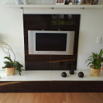 Furniture,Trendy White Wall Paint Flat Screen Tv Wall Design Inspiration With Adorable Tv Wall Unit Plus Beautiful White Mixed Brown Entertainment Cernter On Combined Nice Yellow Potted Plants And Wonderful Black Drum Floor Lamps Also Cool Bright Wood Floor ,Stunningly Beautiful And Modern Flat Screen Tv Wall Designs